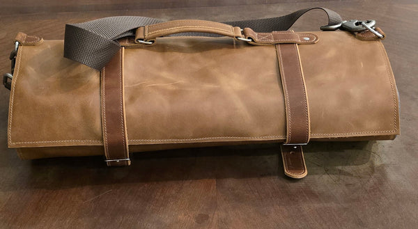 Large leather knife roll rolled and strapped