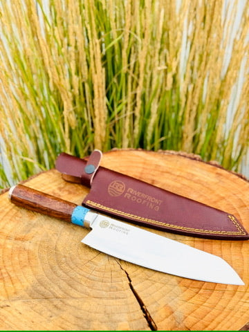 Custom knife with company logo engraved on the blade and embossed leather sheath
