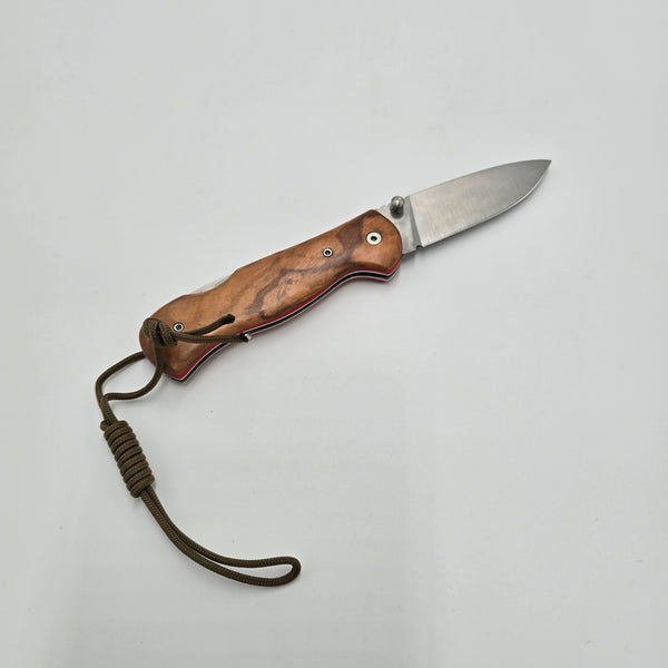 Navaja Forestal Large folding knife open with olive wood handle and paracord lanyard